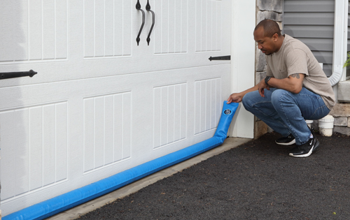 Protect garage doors with flood barrier